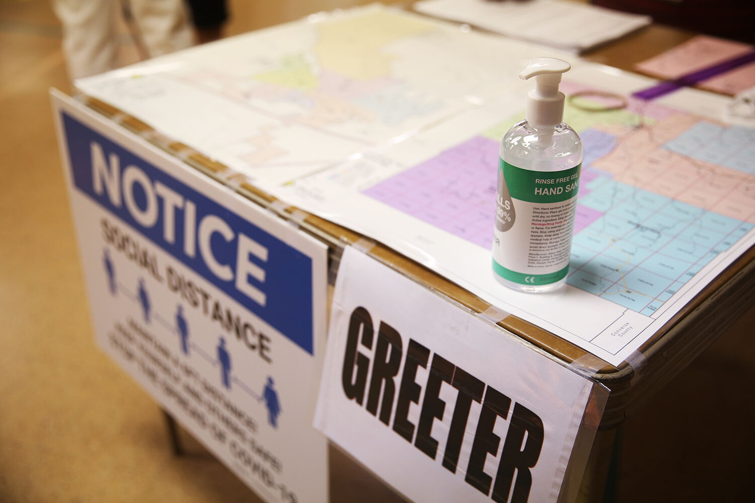 Hand sanitizer bottles sat on every table for use by election judges
